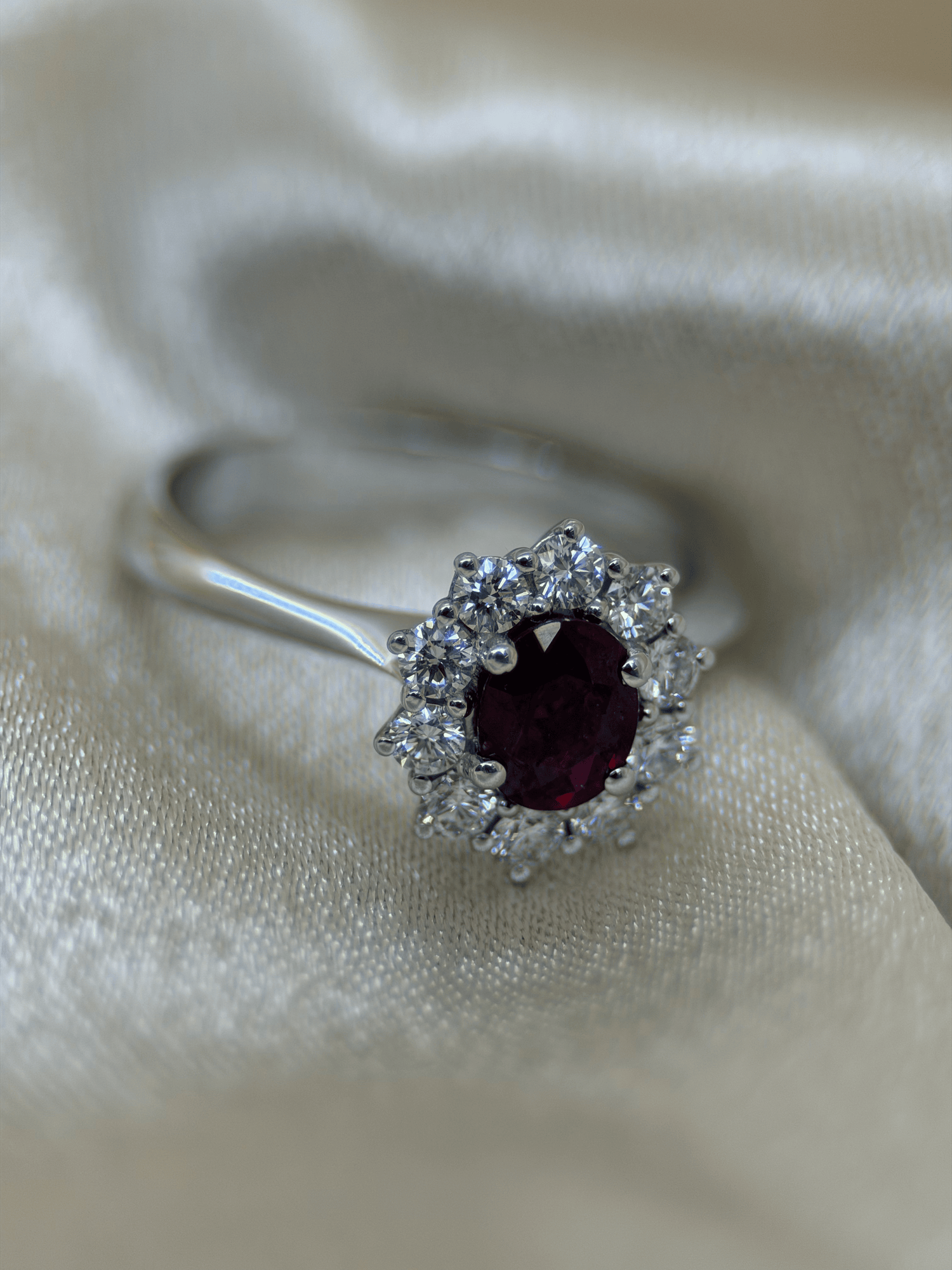 Oval Ruby &amp; Diamond Halo Ring in 18K White Gold – 0.64 ct